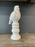 Bird on a pedestal