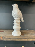 Bird on a pedestal