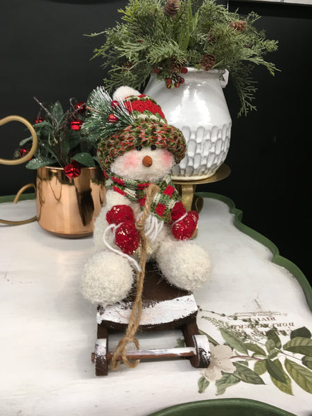 Snowman on sled